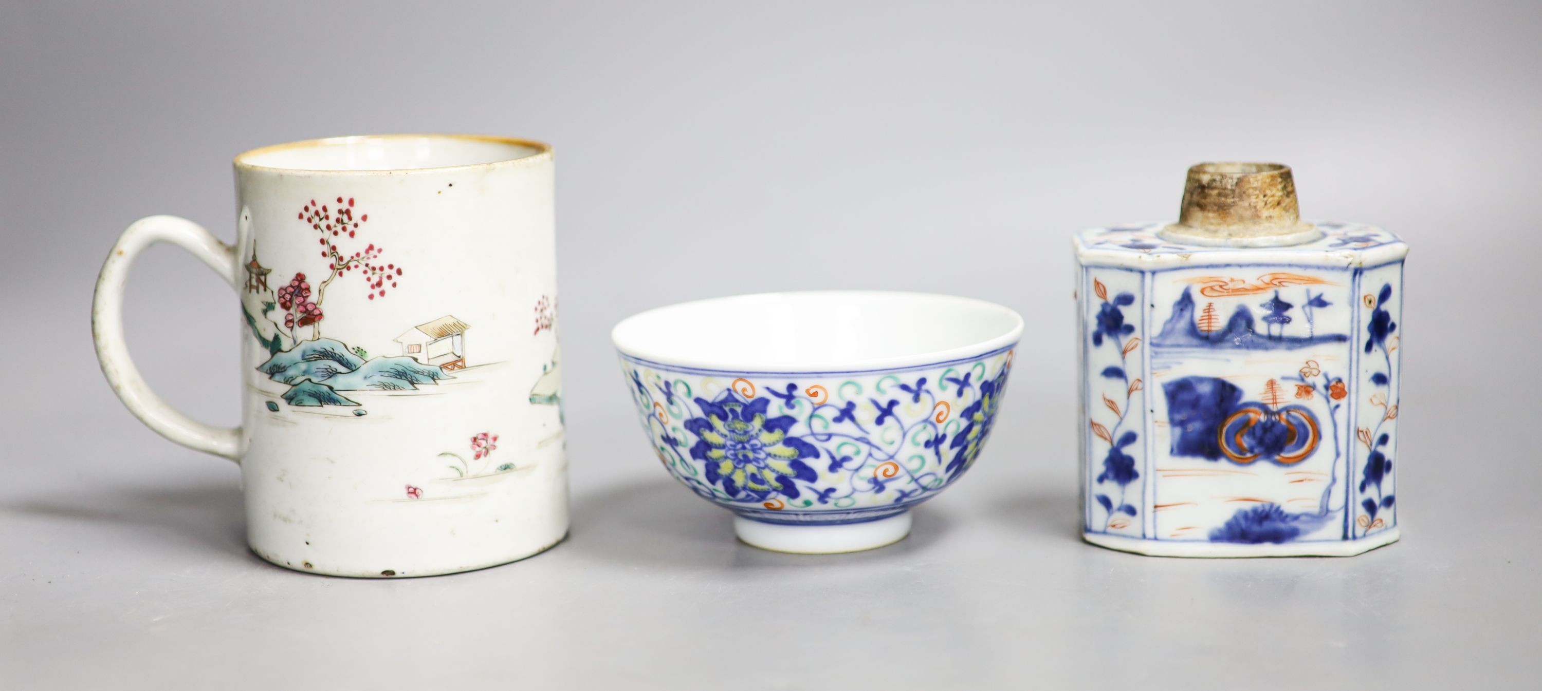 A Chinese famille rose mug, a Chinese Imari tea caddy and a doucai bowl, 18th century and later